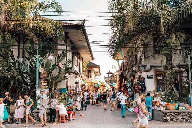 A busy, stall-lined street in central Ubud during Bali's peak season
